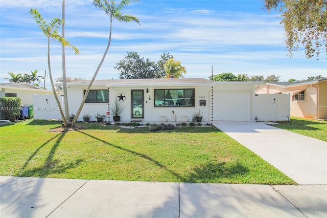 ranch-style house with a garage and a front yard