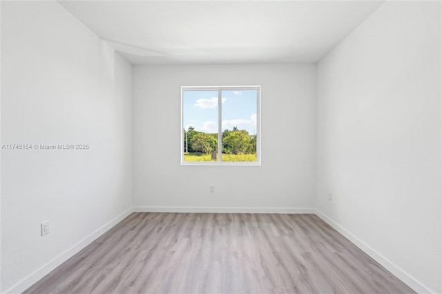 empty room featuring light hardwood / wood-style floors