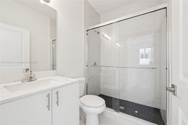 bathroom with vanity, toilet, and walk in shower