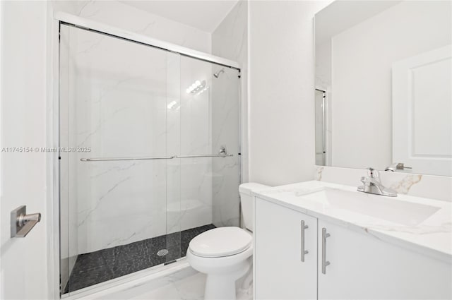 bathroom with vanity, toilet, and walk in shower