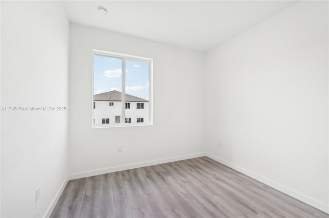 spare room featuring light hardwood / wood-style floors