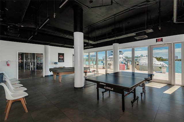 recreation room with a water view, pool table, and french doors