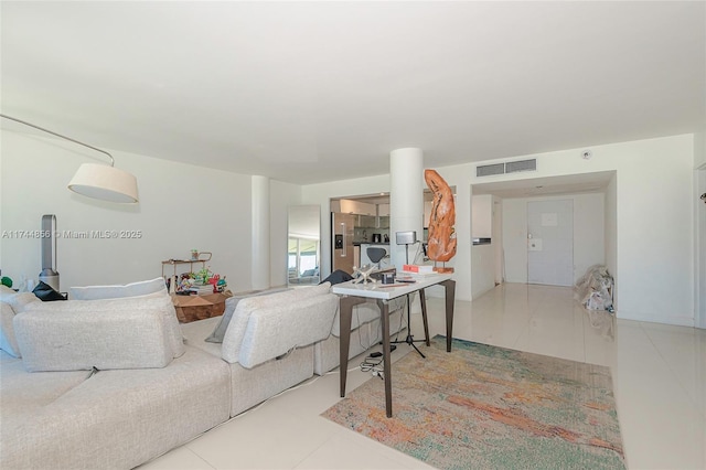 living room with tile patterned floors