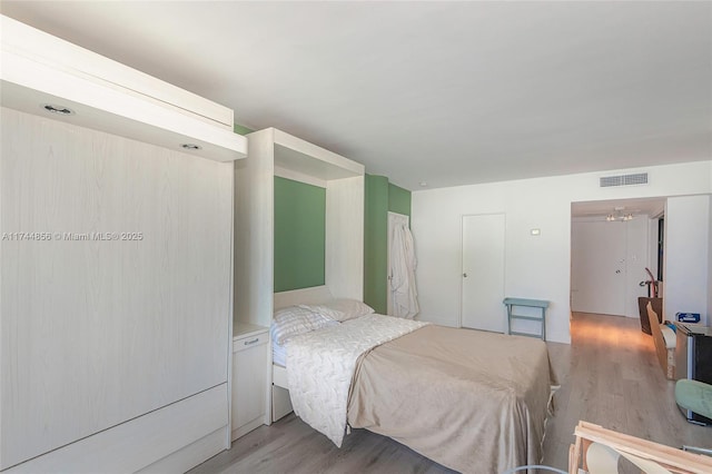 bedroom with light hardwood / wood-style flooring