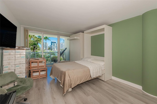 bedroom with light hardwood / wood-style flooring