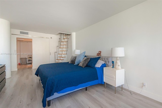 bedroom featuring light hardwood / wood-style floors