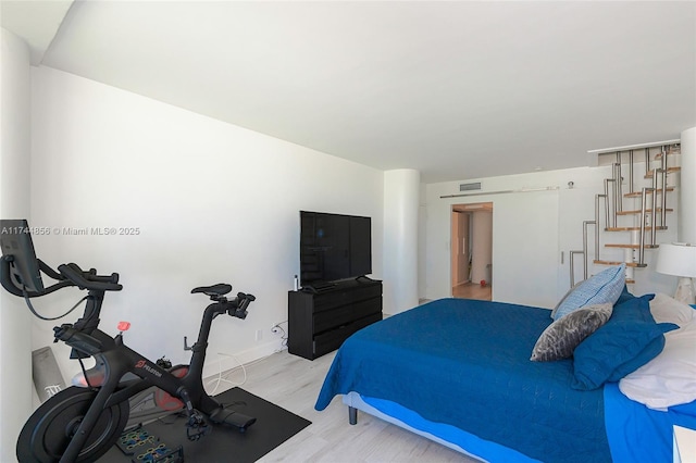 bedroom featuring light hardwood / wood-style flooring