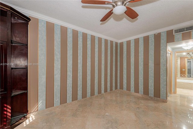 spare room with wallpapered walls, visible vents, a textured ceiling, and ornamental molding