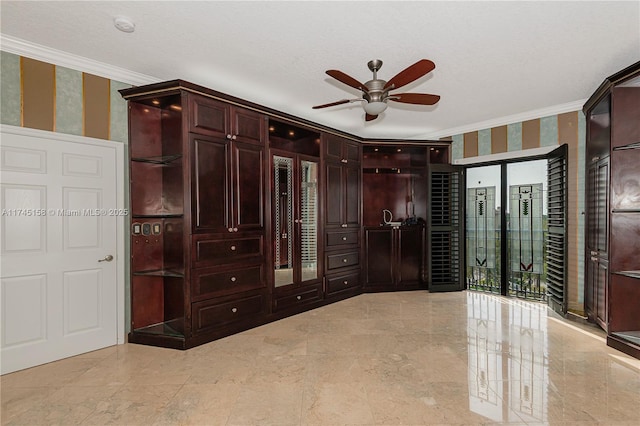 unfurnished bedroom featuring crown molding, a textured ceiling, and wallpapered walls