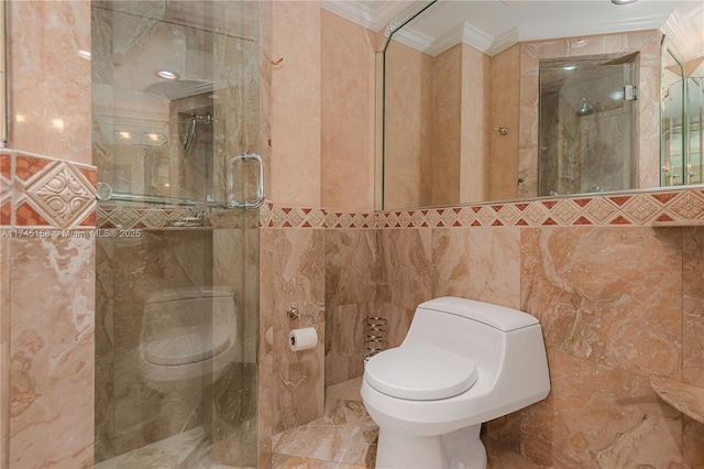 bathroom with tile walls, a shower stall, toilet, and crown molding