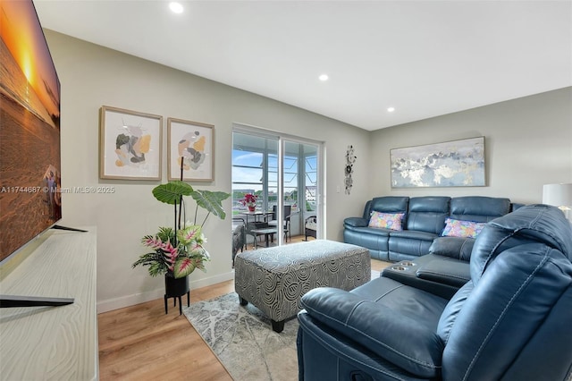 living room with light hardwood / wood-style flooring