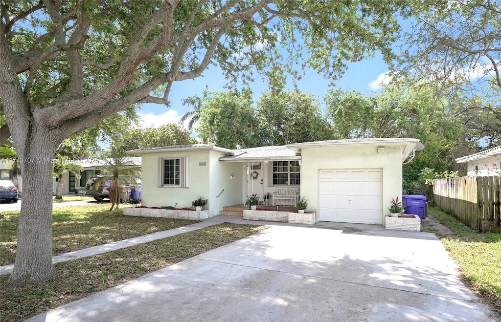 single story home featuring a garage