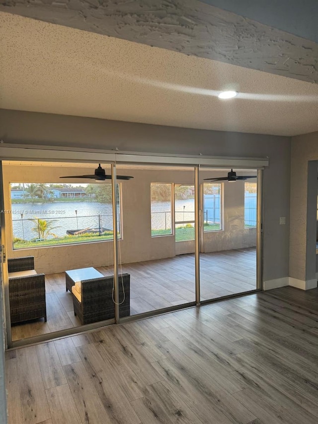 interior space with hardwood / wood-style flooring and a textured ceiling