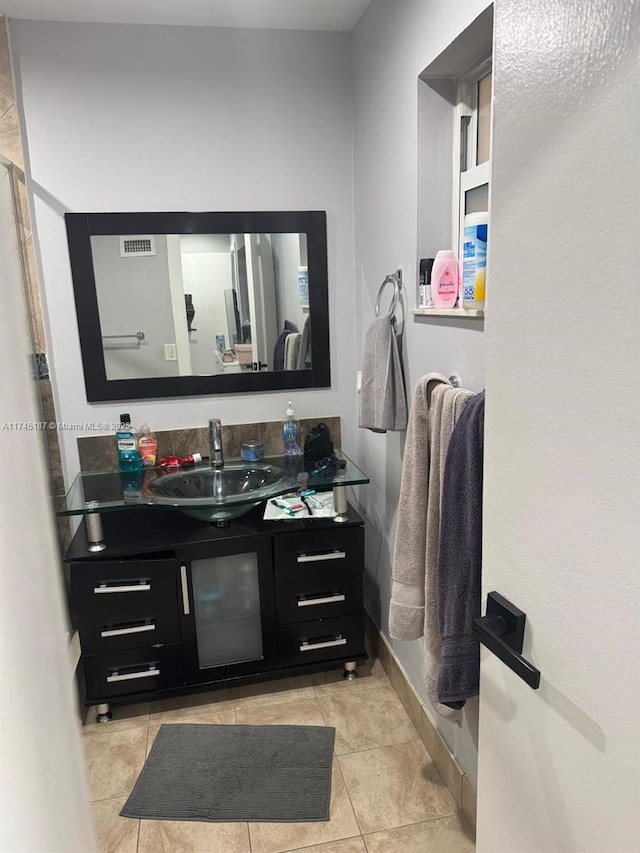 bathroom with tile patterned flooring and vanity