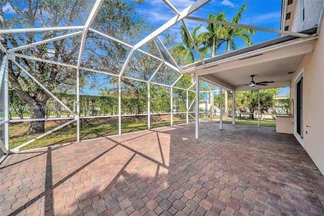 view of patio / terrace with a lanai and a ceiling fan