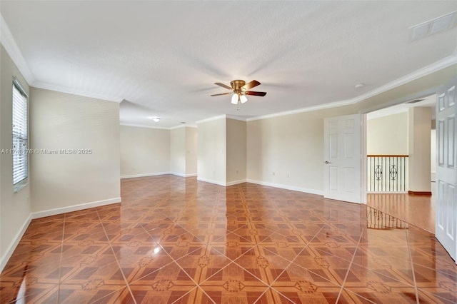 unfurnished room featuring baseboards, visible vents, ceiling fan, and crown molding