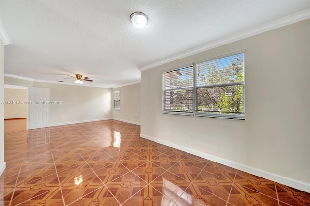 unfurnished room featuring baseboards, ornamental molding, ceiling fan, and a textured ceiling