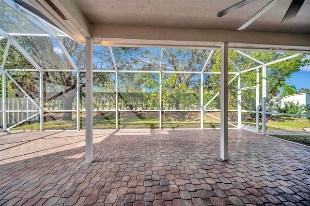 view of patio / terrace with a lanai