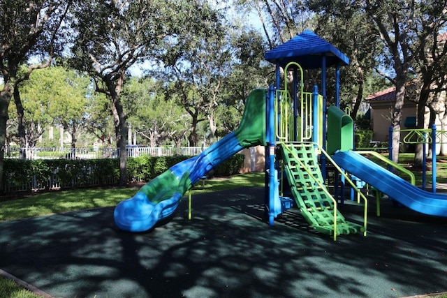 community jungle gym featuring fence