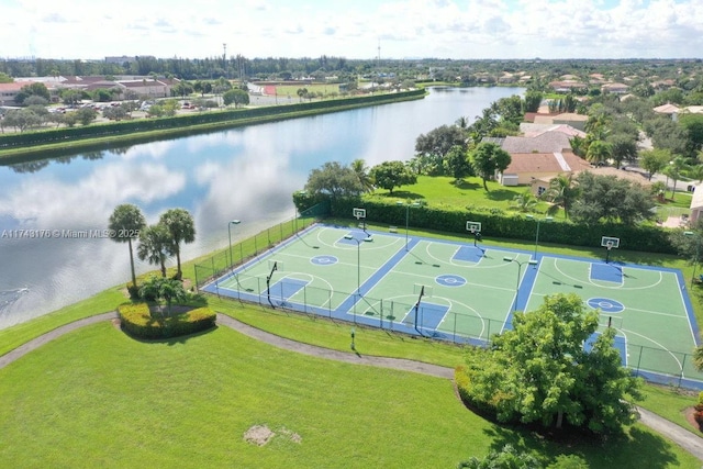 birds eye view of property with a water view