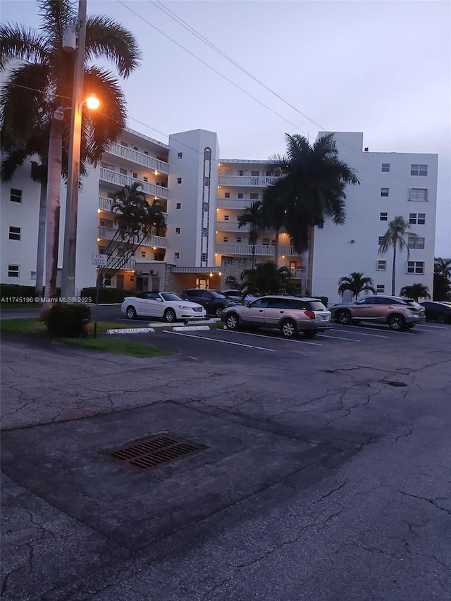 3181 S Ocean Dr Unit 107, Hallandale Beach, FL 33009 - view of apartment building / complex with uncovered parking