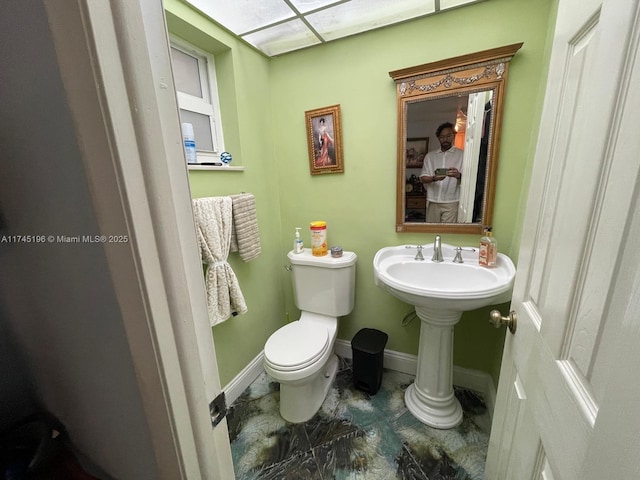 3181 S Ocean Dr Unit 107, Hallandale Beach, FL 33009 - half bathroom with toilet and baseboards