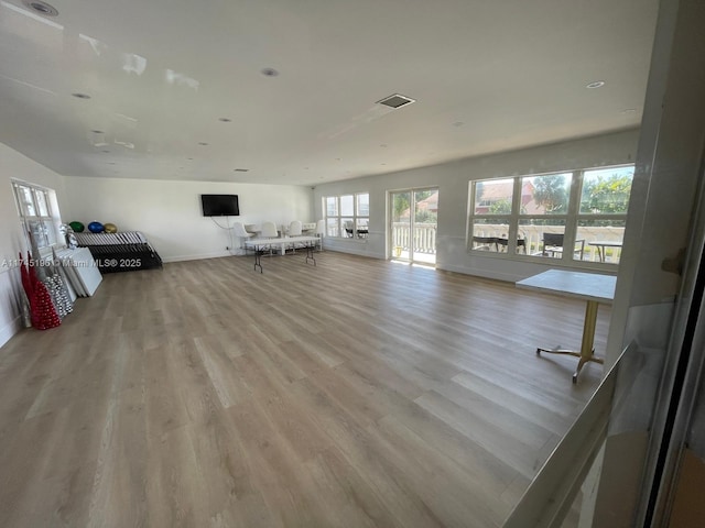 3181 S Ocean Dr Unit 107, Hallandale Beach, FL 33009 - living area featuring light wood-type flooring and healthy amount of natural light