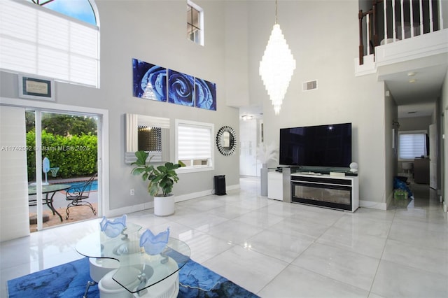 living room featuring a towering ceiling