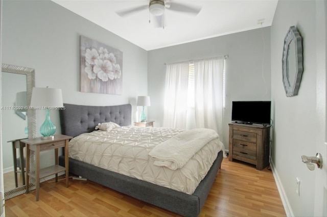 bedroom featuring hardwood / wood-style flooring and ceiling fan