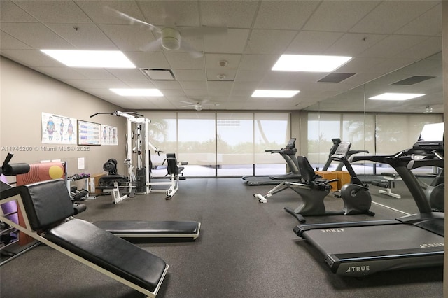 exercise room featuring a paneled ceiling and visible vents