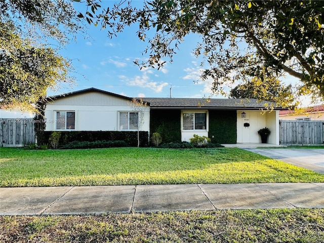 ranch-style house with a front yard