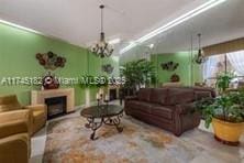 living room with a notable chandelier