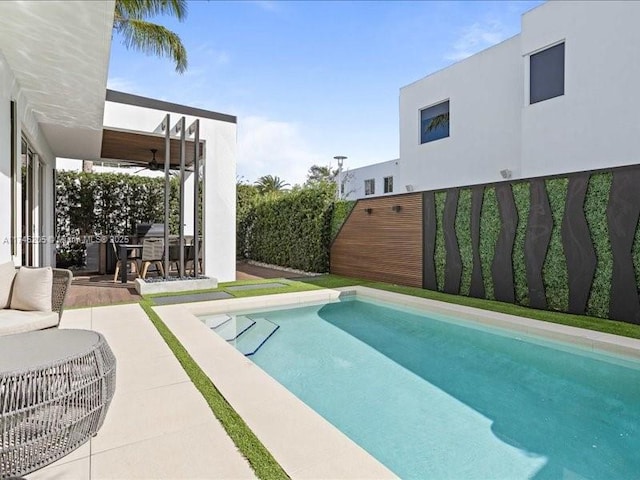 view of swimming pool featuring a patio