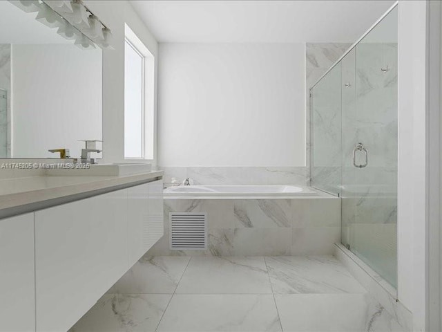 bathroom featuring vanity, plenty of natural light, and shower with separate bathtub