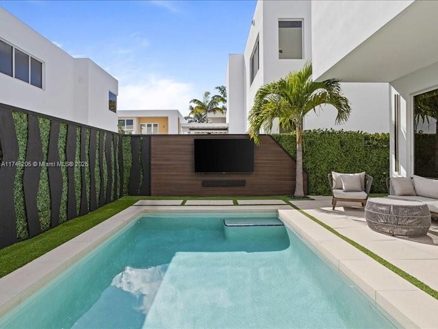 view of pool featuring a patio area