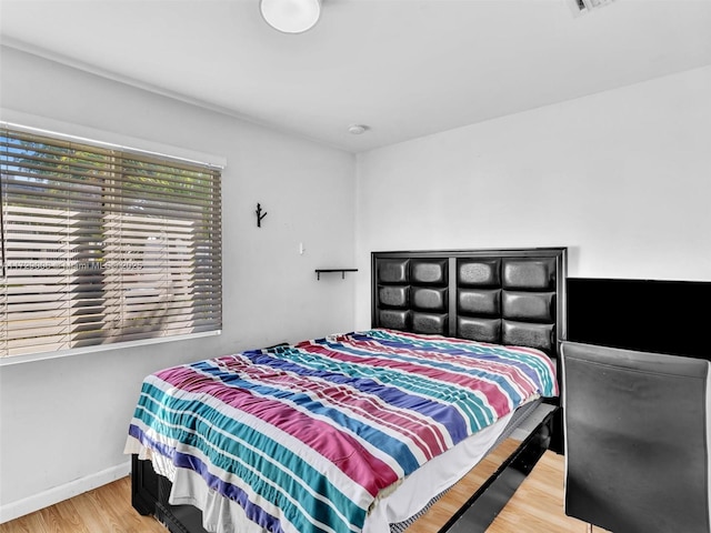 bedroom featuring light hardwood / wood-style floors