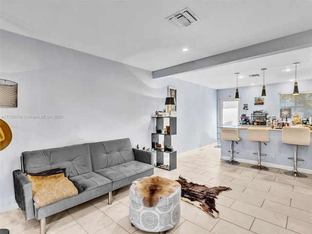 living room with beamed ceiling