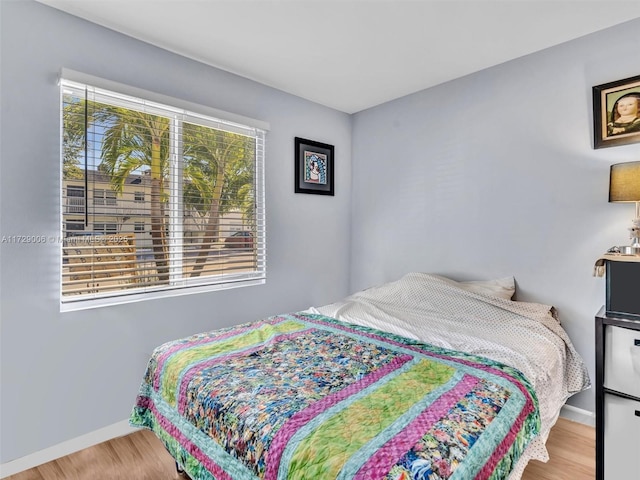 bedroom featuring hardwood / wood-style flooring