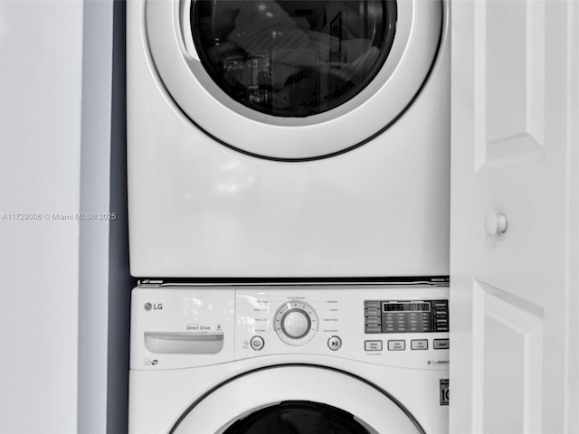 laundry room featuring stacked washing maching and dryer