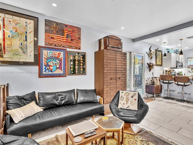 living room with beamed ceiling