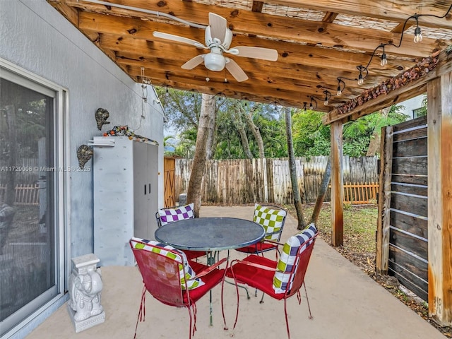 view of patio featuring ceiling fan