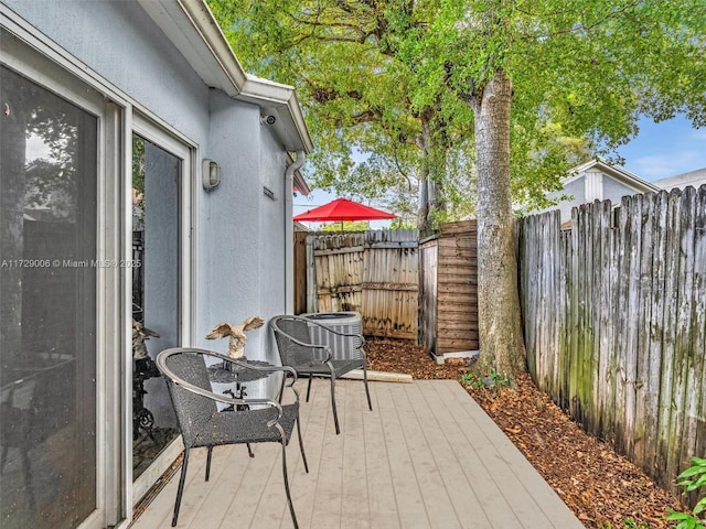 view of patio featuring central air condition unit and a deck