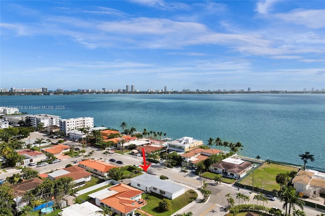 birds eye view of property featuring a water view