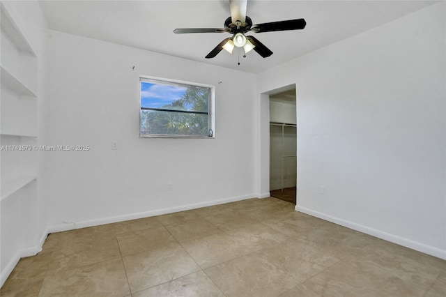 unfurnished room featuring light tile patterned flooring and ceiling fan