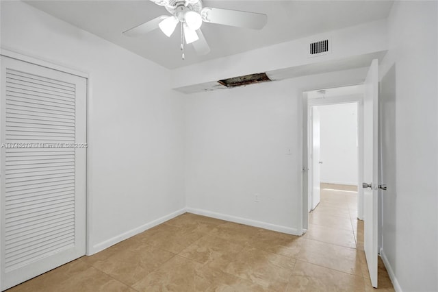 unfurnished bedroom with a closet, ceiling fan, and light tile patterned flooring