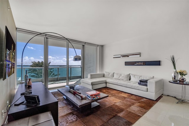 living room with a wall of windows and a water view