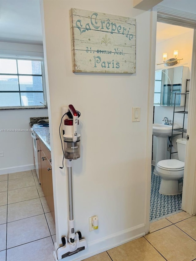 bathroom featuring tile patterned flooring and toilet