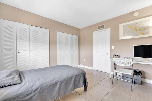 tiled bedroom with two closets