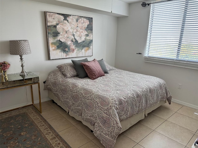 3530 SW 22nd St Unit 706, Miami, FL 33145 - bedroom featuring baseboards and light tile patterned floors