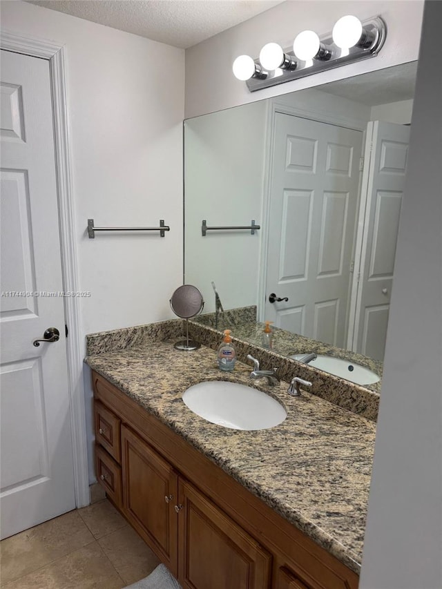 3530 SW 22nd St Unit 706, Miami, FL 33145 - bathroom with tile patterned flooring, a textured ceiling, and vanity